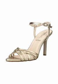 Sandale à talons hauts dorée avec fines brides croisées à l'avant, bride de cheville avec boucle et semelle intérieure en mousse à mémoire de forme rembourrée.