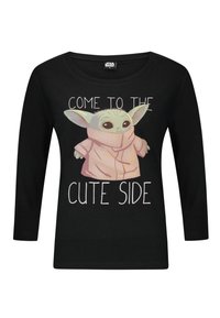 Czarna longsleeve z grafiką postaci z kreskówki o dużych uszach, ubranej w różowy szlafrok, oraz napisem "DOŁĄCZ DO UROCZEJ STRONY."