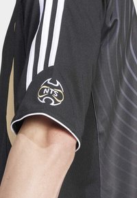 adidas Originals ADIDAS NTS RADIO - Sports T-shirt - black
