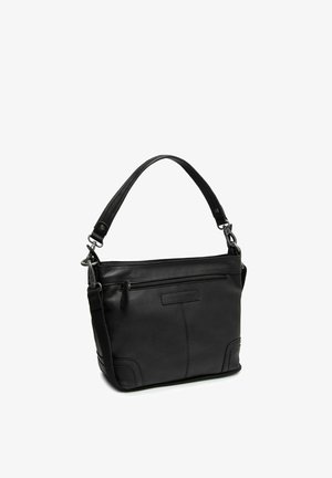 Sac à main en cuir noir avec une anse unique sur le dessus, poche zippée à l'avant et bandoulière amovible sur fond blanc.