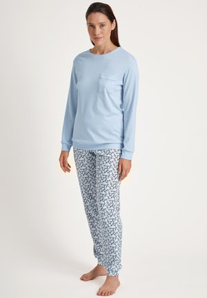 Light blue long-sleeve shirt with a chest pocket, paired with white pants featuring a navy floral pattern. Soft fabric, relaxed fit.