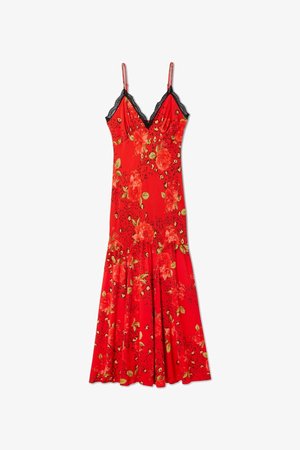 Robe fleurie rouge avec des accents en dentelle noire, corsage ajusté, bretelles fines et jupe évasée. Présente des feuilles vertes et des motifs de fleurs audacieux.