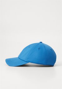 Blue baseball cap with a curved brim, fabric texture, six ventilation holes, and a button at the top. Simple design, no additional accents.