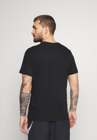 Nike Performance Camiseta estampada - black