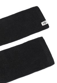 Pair of black knit wrist warmers, one showing a small white label with a logo, laid flat on a white background.