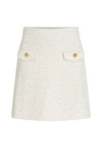 Fehér, texturált szoknya, finom arany pöttyökkel, két elülső zsebbel arany gombokkal és passzos derékrésszel. Kiálló sziluett.