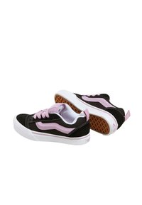 Black and pink suede sneakers with white rubber soles, featuring contrasting stitching and a classic side stripe design.
