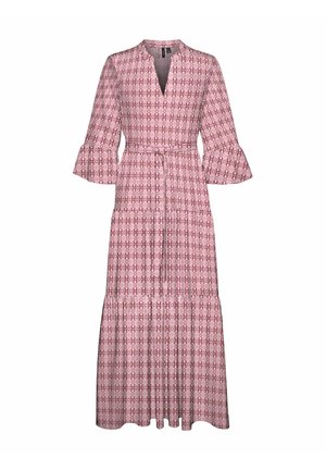 Maksimalus suknele su V formos iškirpte, ilgomis platėjančiomis rankovėmis ir sužąsčiuotu liemeniu. Pasižymi rožinės ir baltos geometricinės raštas ir sluoksniuota sijoną.