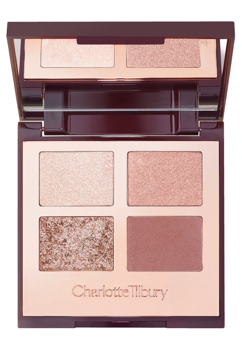 Compact eyeshadow palette with four shades: two shimmering light pinks, one glittery rose gold, and one matte mauve, in a mirrored case.