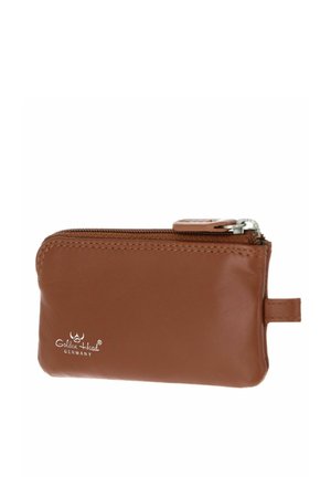 Petit étui en cuir marron avec fermeture éclair métallique et languette latérale, marqué « Golden Head Germany » en blanc.