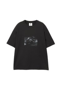 Black cotton t-shirt with a loose fit, featuring a graphic print of a car on the front. Crew neck and short sleeves.
