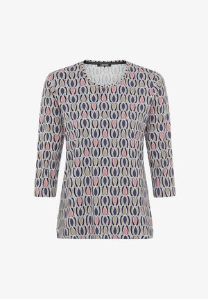 Long-sleeve top featuring a circular pattern in navy, pink, and cream colors on a soft fabric. Round neckline and relaxed fit.