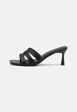 GEMMA - Heeled mules - black