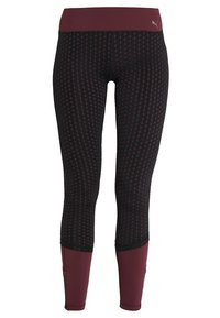 Czarne i bordowe legginsy damskie w kropki, z wysokim stanem oraz bordowymi dolnymi nogawkami z bocznymi zamkami i logo Pumy.