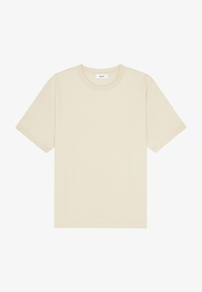 T-shirt beige in cotone a maniche corte con girocollo e etichetta del marchio visibile all'interno del colletto.