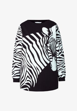 Sorte og hvide langærmede skjorte med et stort zebra-grafik, med et abstrakt mønster på den ene ærme og en solid sort krop.