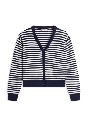 Ριγέ κοντό ζακέτα σε ναυτικό μπλε και λευκό με βαθύ V-λαιμόκοψη, υφή με ρίγες, κλείσιμο με έξι κουμπιά και αντίθετες μανσέτες και τελείωμα σε ναυτικό μπλε χρώμα.