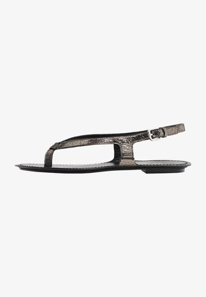 Metallic gray flat sandal with a T-strap design, featuring a leather-like texture and a thin ankle strap with a silver buckle.