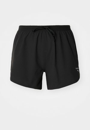 Shorts de bain noirs en tissu léger et lisse. Équipés d'une taille élastique avec cordon de serrage et d'un logo blanc sur le côté.