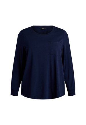 Dugih rukava tamnoplava košulja od pamuka, s okruglim izrezom i jednim džepom na prsima te opuštenim krojem. Glatka tekstura.