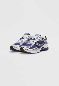 Blue and white athletic shoes with mesh fabric, a cushioned sole, and black accents. Features reflective detailing and intricate design lines.