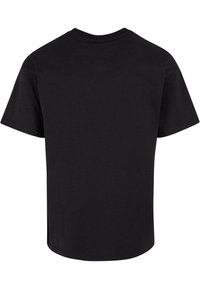 Sort T-shirt med korte ærmer lavet af bomuld. Har en rund halsudskæring og et ensfarvet design med en løs pasform og glat tekstur.