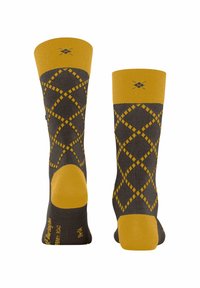 Brązowe i żółte skarpetki bawełniane z wzorem w romby. Żółte prążkowane góry oraz wzmacniane żółte pięty i palce.