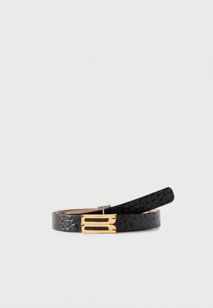 Black textured leather belt with gold rectangular buckle featuring two horizontal cutouts, coiled on a light gray background.