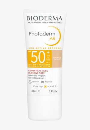 Tube de crème solaire Bioderma Photoderm AR, plastique blanc, 30 ml, étiquette SPF 50+, accents orange, crème anti-rougeurs pour peau réactive.