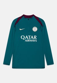 Teal pitkähihaiselta urheilupaidalta, jossa on neljänneksen vetoketju, viininpunaiset yksityiskohdat hartioilla, kultainen logo ja "QATAR AIRWAYS" -teksti edessä.