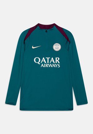 Haut de sport à manches longues teal avec fermeture éclair quart, accents bordeaux sur les épaules, logo doré et texte "QATAR AIRWAYS" sur le devant.