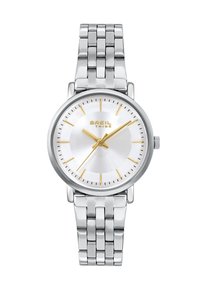 Montre en acier inoxydable argenté avec un boîtier rond, un cadran texturé blanc, des accents dorés et un bracelet à maillons. Nom de la marque affiché sur le cadran.