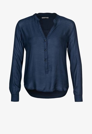 Blouse bleu marine à manches longues avec un col en V, trois boutons sur le devant et un ourlet légèrement arrondi.