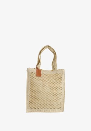 Borsa tote in tessuto colore beige con design a rete aperta, finitura testurizzata e due manici resistenti. Presenta un'etichetta in pelle attaccata alla tracolla.