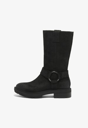 Black suede knee-high boots with a flat sole, featuring a ring accent on a strap. The design includes a textured surface and vertical seams.
