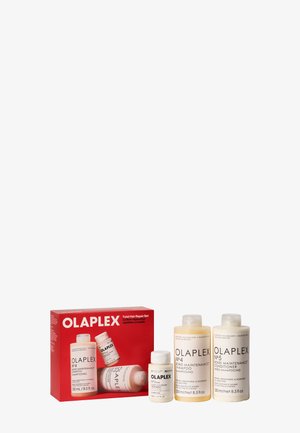 Set Olaplex Total Hair Repair con champú para mantenimiento de enlaces, acondicionador y tratamiento reparador en botellas etiquetadas de 250 ml y 50 ml.