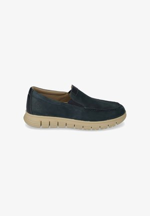 Scarpa casual slip-on da uomo blu navy con suola beige strutturata e dettagli cuciti, logo laterale e pannelli elastici per una facile calzata.