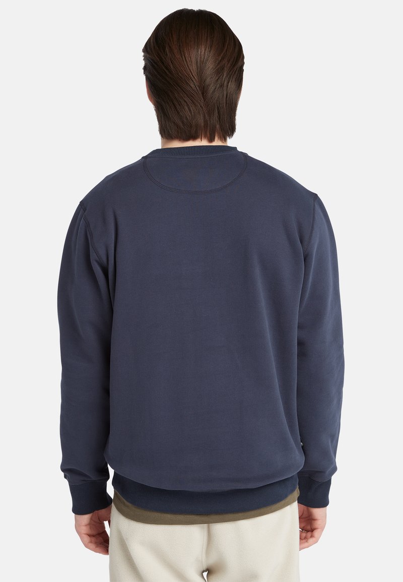 Felpa blu navy con scollatura rotonda, polsini e fondo a coste, e vestibilità morbida. Realizzata in tessuto morbido e strutturato.