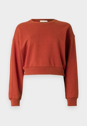 Cropped sweatshirt in rust orange, made from soft cotton fabric, featuring long sleeves, a round neckline, and ribbed cuffs.