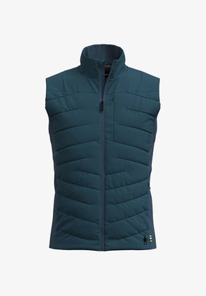 Teal vadderad väst med hög krage, dragkedja fram och texturerat chevronmönster. Har sidofickor och en logotypdetalj i fållen.