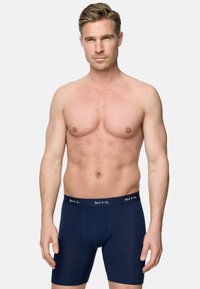 Marinblå boxershorts tillverkade i mjukt material, med en tät passform och en elastisk midja med vit logodetalj.