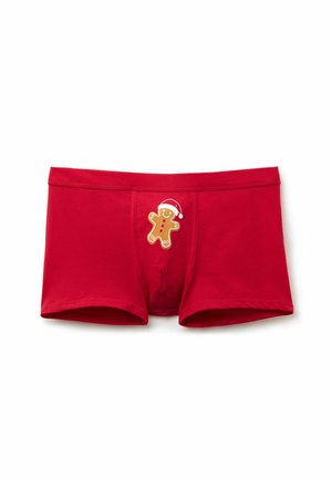 Czerwone bawełniane slipki w kratkę z nadrukiem piernikowego ludzika, ubranego w świąteczną czapkę. Projekt zawiera kontrastowe przeszycia i dopasowany kr�ój.