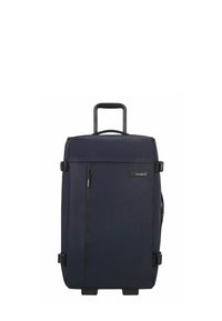 Valise à roulettes bleu marine foncé avec un tissu texturé, un grand compartiment principal, une poignée robuste et une poche frontale zippée. Roues durables incluses.
