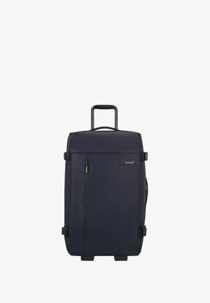 Valise à roulettes bleu marine foncé avec un tissu texturé, un grand compartiment principal, une poignée robuste et une poche frontale zippée. Roues durables incluses.