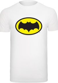White cotton t-shirt featuring a large Batman logo in black and yellow, set within an oval outline. Simple and bold design.