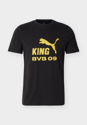 Crna majica kratkih rukava s žutim logotipom Puma iznad natpisa "KING BVB 09" na prsima.