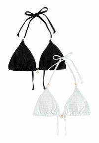 Svart och vit triangeltopp i bikini med texturerat tyg, justerbara band och detaljer i glänsande guldton i mitten.