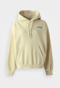 Sweatshirt bege com um bolso frontal, capuz com cordão e logotipo em azul "obey" no lado esquerdo do peito. Tecido suave e ajuste descontraído.