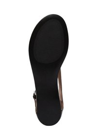 Black rubber sole of a shoe, featuring a smooth texture with horizontal ridges for grip, demonstrating a flat design and simple shape.