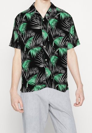 Short-sleeve shirt with a black background, featuring a green and white palm leaf print. Buttons and a relaxed fit design.